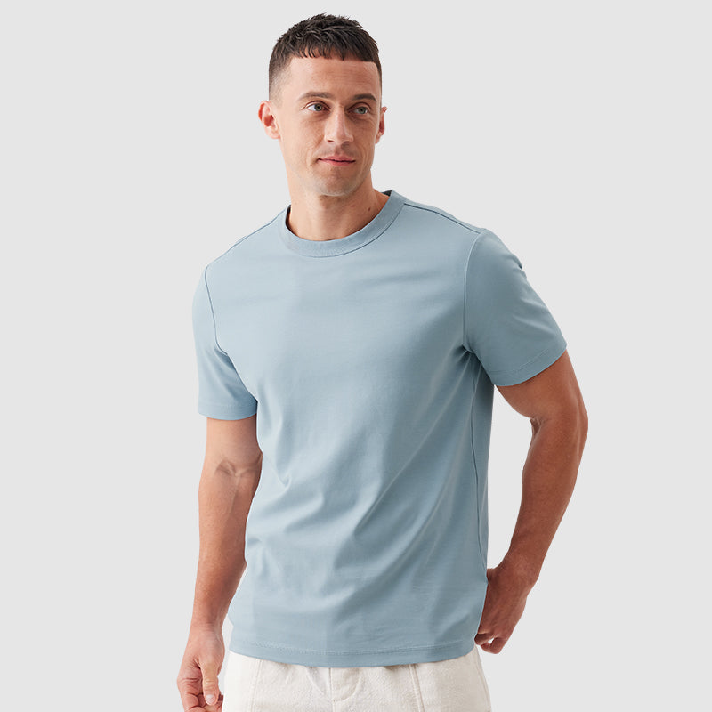 Two premium lifestyle tees compared, one recycled-poly blend and one Tencel-modal with stain repellent coating