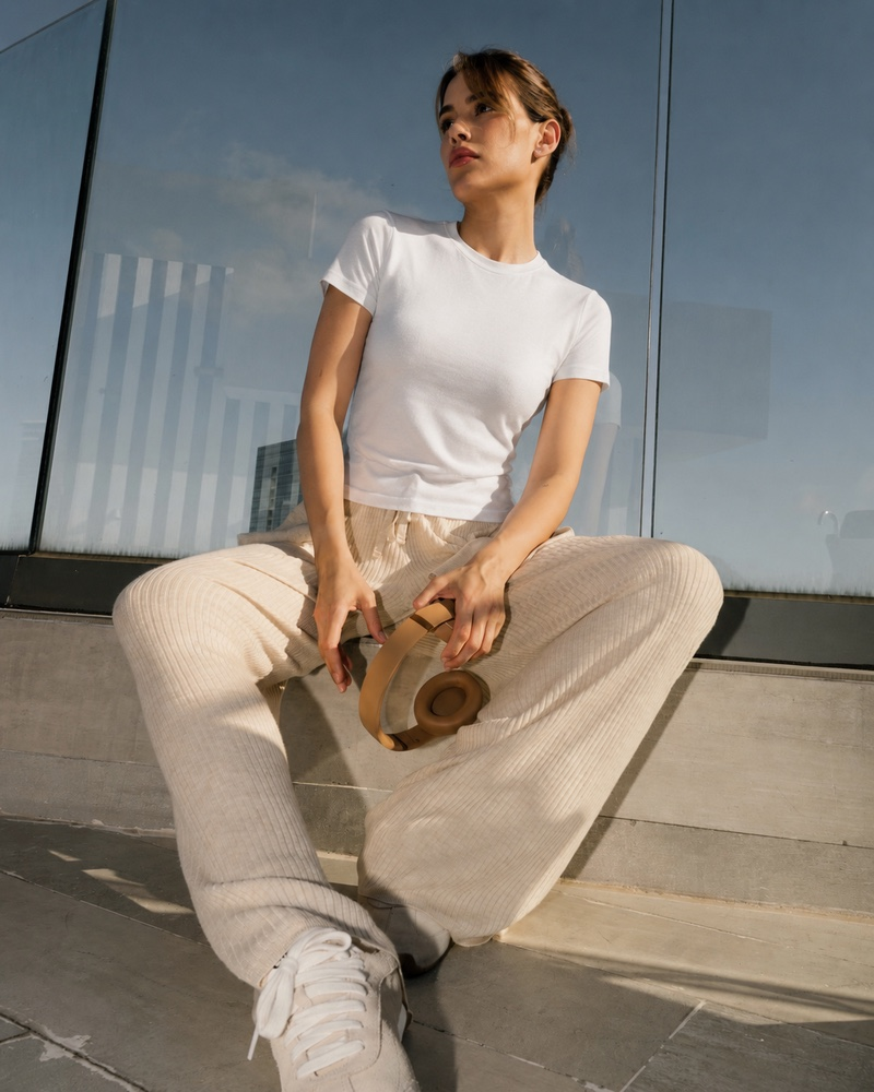 Influencer in slim white tee